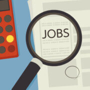 illustration of desktop with a magnifying glass over jobs section in newspaper