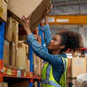 Woman working in a warehouse.